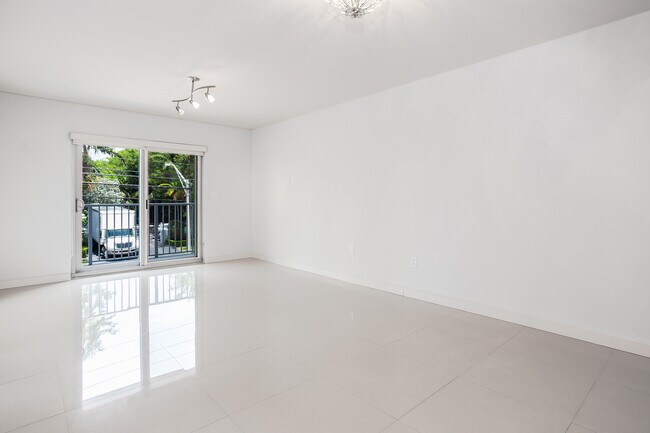Living room with white porcelain floors - 1674 Bay Rd