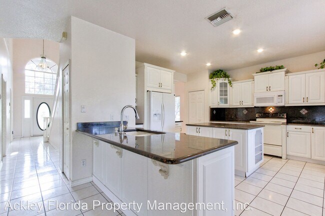 Foto del edificio - 4 br, 3 bath House - 4905 Lake Cecile Driv...