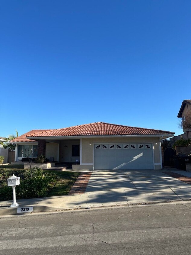 Primary Photo - Spacious 4-Bedroom Home with Modern Comfor...