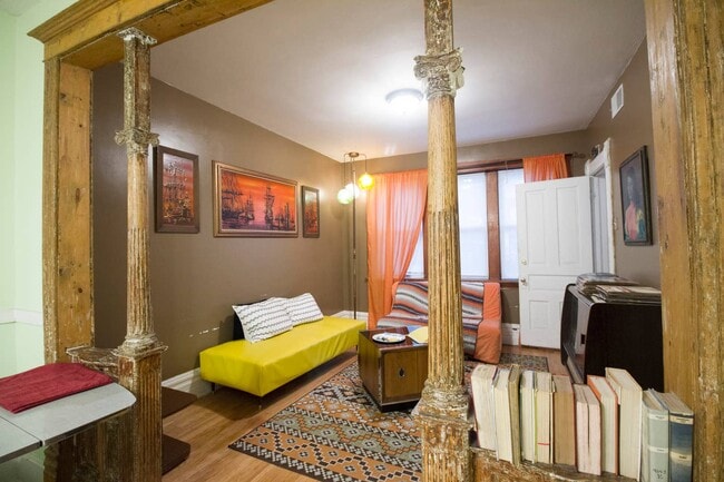 Staged pre-renovation photo of living room - 2640 West Thomas Street