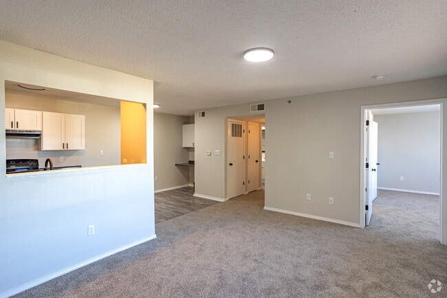 Bright, open-concept living room with space to relax or entertain. - Edmond at Twenty500