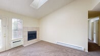 Located at 4373 Montebello Dr in Colorado Springs, CO, this two-bedroom, two-bathroom residence offers a functional and comfortable single-floor layout. The combined living and dining area serves as the heart of the home, highlighted by a tile-surround fireplace, a skylight, and a baseboard heating system. Neutral carpet, textured ceilings, and warm cream-toned walls create a consistent, understated aesthetic throughout. A pass-through window connects the living area to the galley-style kitchen, which features warm oak cabinetry, laminate countertops, wood-look flooring, and white appliances including a range, refrigerator, and dishwasher. The primary bedroom is generously sized, complete with a closet and direct access to one of the two full bathrooms. The second bedroom is carpeted with its own closet and a window that brings in natural light. Both bathrooms include a tub-shower combination with white tile surrounds and wood cabinetry for storage. A dedicated laundry area adds convenience, while five closets throughout the home provide exceptional storage capacity. A private balcony offers an outdoor retreat. The layout flows efficiently through a central hallway, making this a well-appointed residence in a desirable Colorado Springs location.