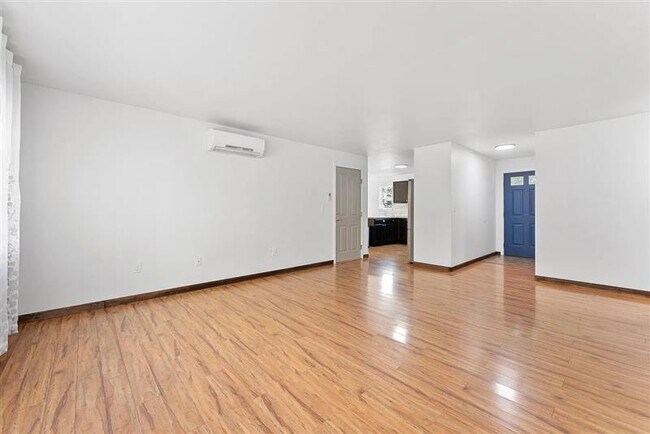 Building Photo - Enjoy this air conditioned freshly painted...