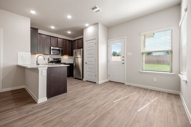 Building Photo - Modern 3-Bed, 2.5-Bath Townhome in New Bra...