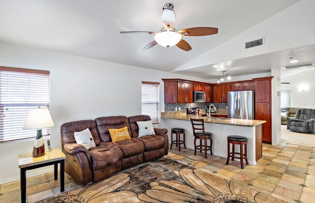 Building Photo - Single Story with large covered patio. Two car garage with uncovered gated parking stall. New vin...