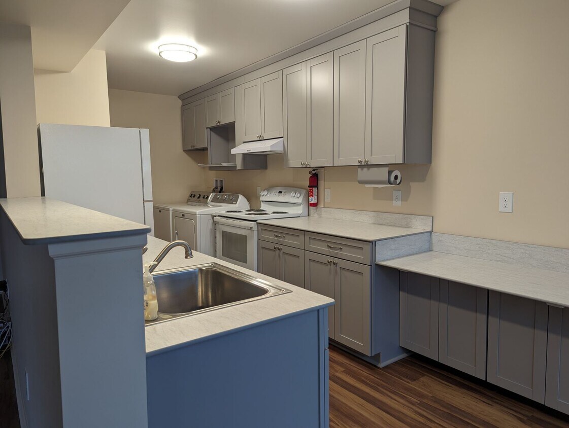 Kitchen with lowered eating counter on the right side of photo. Lots of counterspace and storage. Fu - 33 Falcon Ln W