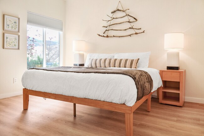 Plush king size bed in primary bedroom. - 3850 Strawberry Field Grv