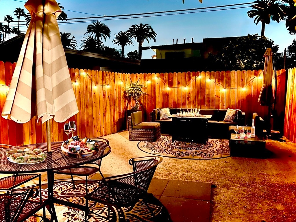 Gather and relax around the fire pit table. - 2824 S Orange Dr