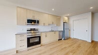 Located at 644 Fairway Ave in Langford, BC, this thoughtfully designed one-bedroom, one-bathroom unit with a den offers a bright and functional layout across a single floor. Light-toned hardwood flooring flows throughout the space, complementing the clean, modern aesthetic.

The kitchen is a standout feature, outfitted with light wood cabinetry, grey countertops, a white tile backsplash, and a full suite of stainless steel appliances including a range with oven, over-the-range microwave, dishwasher, and refrigerator. The kitchen opens seamlessly into the combined dining and living area, creating an airy, open-concept feel ideal for everyday living and entertaining.

The bedroom is a comfortable, well-lit room featuring a large window that invites natural light and offers views of the surrounding neighbourhood. A versatile den provides additional space suitable for a home office or guest room. Two closets offer ample storage throughout the unit.

The bathroom is clean and functional, featuring a full soaker tub with shower, a light wood vanity with grey countertop, and matte black hardware accents that echo the modern design language found throughout the home. In-suite laundry adds everyday convenience, and a private balcony extends the living space outdoors.