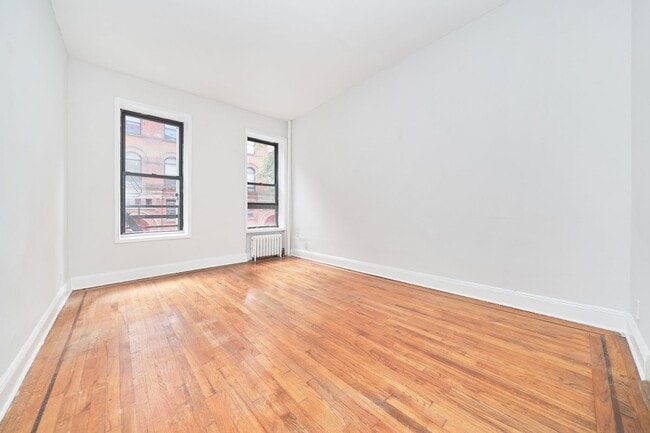 Building Photo - JUST LISTED STUDIO IN THE HEART OF HELL’S KITCHEN