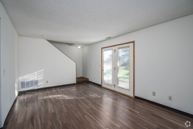 3 habitaciones, 2 baños - 1100 pies cuadrados - Sala de estar - Timber Ridge Townhomes