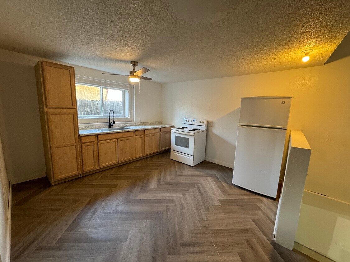 Newly renovated kitchen with oven/stove and refrigerator and brand new cabinets - 1718 E Abriendo Ave