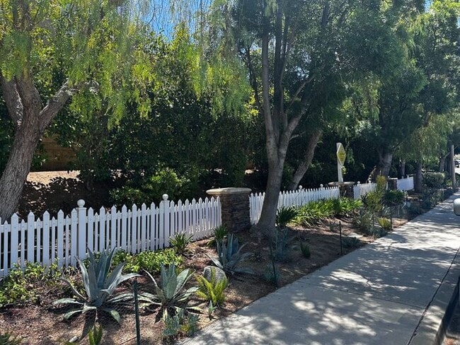 Building Photo - Nestled in a Quiet  Peaceful Valencia Community is ...