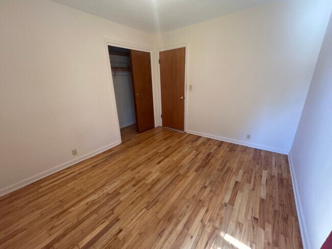 Building Photo - Spacious 2 Bedroom 1 Bath Duplex in Park-Like Setting - Pets Welcome