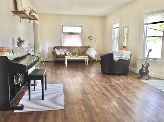 Open-concept living space. - 1201 29th Ave NE