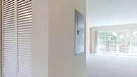 This Newport Village apartment offers a well-designed living space of 1010 square feet on a single floor. The unit features two bedrooms, with the primary bedroom boasting a generous 170 square feet. The open-concept layout seamlessly combines the kitchen and living room, creating a spacious and inviting atmosphere. The modern kitchen is equipped with stainless steel appliances, dark wood cabinetry, and granite countertops, complemented by a stylish mosaic tile backsplash. 

The living area is bright and airy, with plush carpeting and large windows that flood the space with natural light. A sliding glass door leads to an outdoor area, perfect for enjoying fresh air and views. Both bedrooms are well-proportioned, featuring ceiling fans and ample closet space with louvered doors. The bathroom is updated with contemporary fixtures and finishes, including a tiled floor and a vanity with under-sink storage.

Throughout the apartment, neutral-toned walls provide a blank canvas for personalization. The unit also includes in-unit laundry facilities for added convenience. With its thoughtful design and modern amenities, this Newport Village apartment offers a comfortable and stylish living environment.