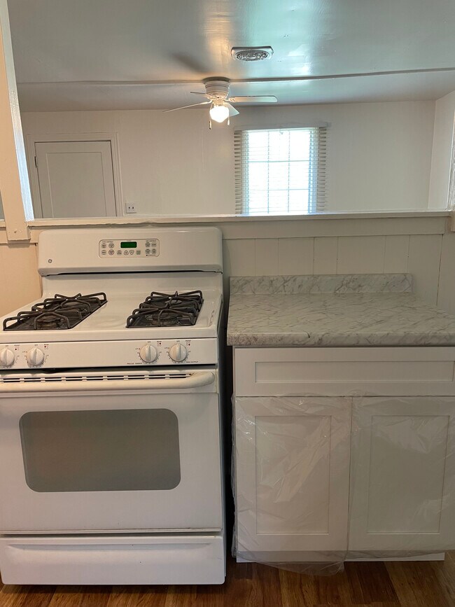 Gas stove and oven, new countertop and cabinets - 2220 Ola Ln
