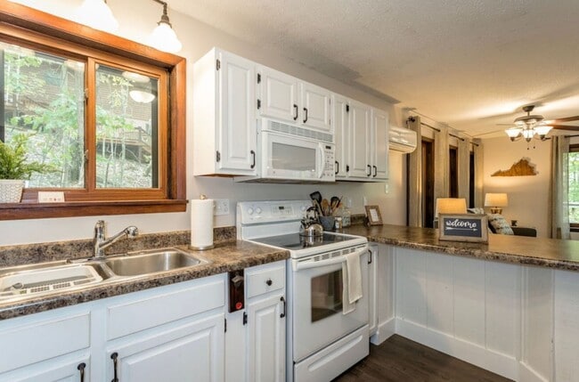 Building Photo - Warm and Welcoming Two-Bedroom Home with Bonus Office Space, and an Open Concept Design. Situated...