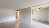 Located at 5849 Sunrise Vista Dr in Citrus Heights, CA, this single-floor, two-bedroom, one-bathroom unit offers a clean and functional layout with modern updates throughout. Light wood-style flooring runs continuously across all living areas, complemented by crisp white walls and textured ceilings that lend a bright, neutral aesthetic.

The galley-style kitchen is a standout feature, showcasing granite countertops, gray shaker cabinetry, stainless steel appliances including a refrigerator, range, and over-the-range microwave, as well as a stainless steel sink. A skylight and window provide natural light, making the space feel open and airy despite its efficient footprint.

The spacious living room offers a generous open area bathed in natural light, with ample room for a variety of furniture arrangements. Both bedrooms are well-proportioned, with the primary bedroom offering a comfortable retreat. One bedroom features dual closet doors, providing practical storage options.

The full bathroom is finished with a granite-topped wood vanity, a shower-tub combination with clean white surround, and a window that introduces natural light. A dedicated hallway connects the rooms efficiently, completing this well-organized and thoughtfully updated living space.