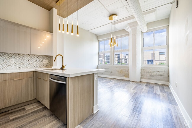 1BR, 1BA - 794SF - Kitchen / Living Room - The Huffman at The Fire Blocks District