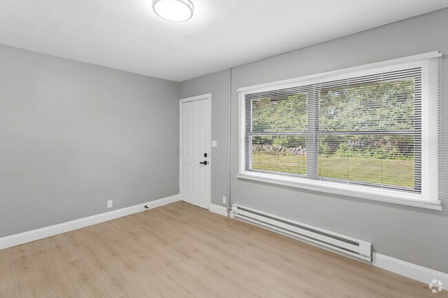 4BR, 1BA - 1,200 SF - Living Room - Hymann Heights Apartments