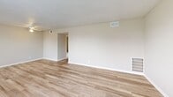 Located at 300 Berkley Dr in Nashville, TN, this two-bedroom, one-bathroom unit offers a practical and comfortable single-floor layout. The living room is bright and open, featuring light wood-style vinyl flooring, neutral beige walls, a textured ceiling, and a window that allows natural light to fill the space. The layout flows easily from the living area into the kitchen, which is equipped with white cabinetry, a double-basin sink, a black refrigerator, an electric range, and a window above the sink for added light. Both bedrooms are carpeted and feature textured ceilings. The spacious primary bedroom includes two closets — one with a sliding door and another walk-in style — providing ample storage. The second bedroom is fitted with a ceiling fan and light fixture. A smaller room with wood-style flooring serves as a flexible secondary space. The hallway connects the rooms efficiently throughout the unit. The full bathroom features a tub/shower combination with a white surround and a window for natural ventilation. Throughout the unit, consistent neutral tones, clean white trim, and practical finishes create a cohesive and functional living environment.