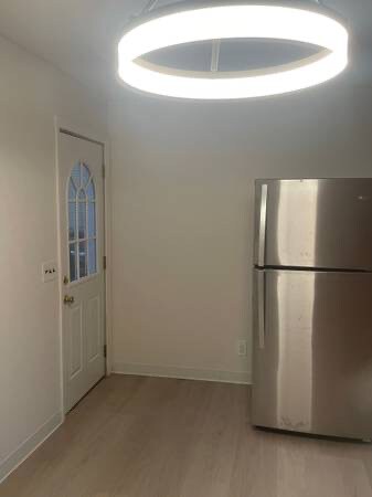 Kitchen with exit door. - 295 Gainsborg Ave E
