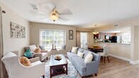 Located at 3453 Timber Run Dr in Valrico, FL, this single-story 2-bedroom, 3-bathroom home offers a thoughtfully designed layout that maximizes comfort and functionality. The open-concept living and dining area is bright and welcoming, featuring wood-look flooring, a ceiling fan, and large windows with a built-in window seat that floods the space with natural light and offers pleasant outdoor views. Sliding glass doors provide direct access to a private patio, enhancing the indoor-outdoor connection.

The kitchen is well-equipped with rich wood cabinetry, granite-style countertops, a mosaic tile backsplash, and a full suite of black appliances. A peninsula counter opens to the dining area, where a pendant light creates an inviting atmosphere for meals.

The primary bedroom features vaulted ceilings, plush carpeting, a ceiling fan, and a large window that brings in ample natural light. Additional bedrooms are equally comfortable with carpet flooring and generous closet space. The home includes four closets in total, offering excellent storage throughout.

Three bathrooms feature wood-look flooring and warm vanity cabinetry with granite-style countertops. A conveniently located stacked laundry unit, a pantry, and a welcoming entrance complete this efficiently designed and move-in-ready home.