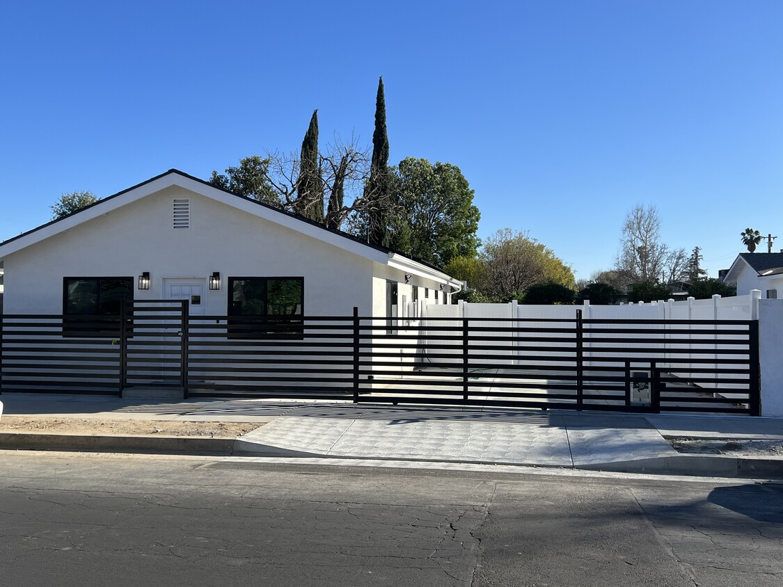 Front of house with private Gated parking - 8458 Darby Ave