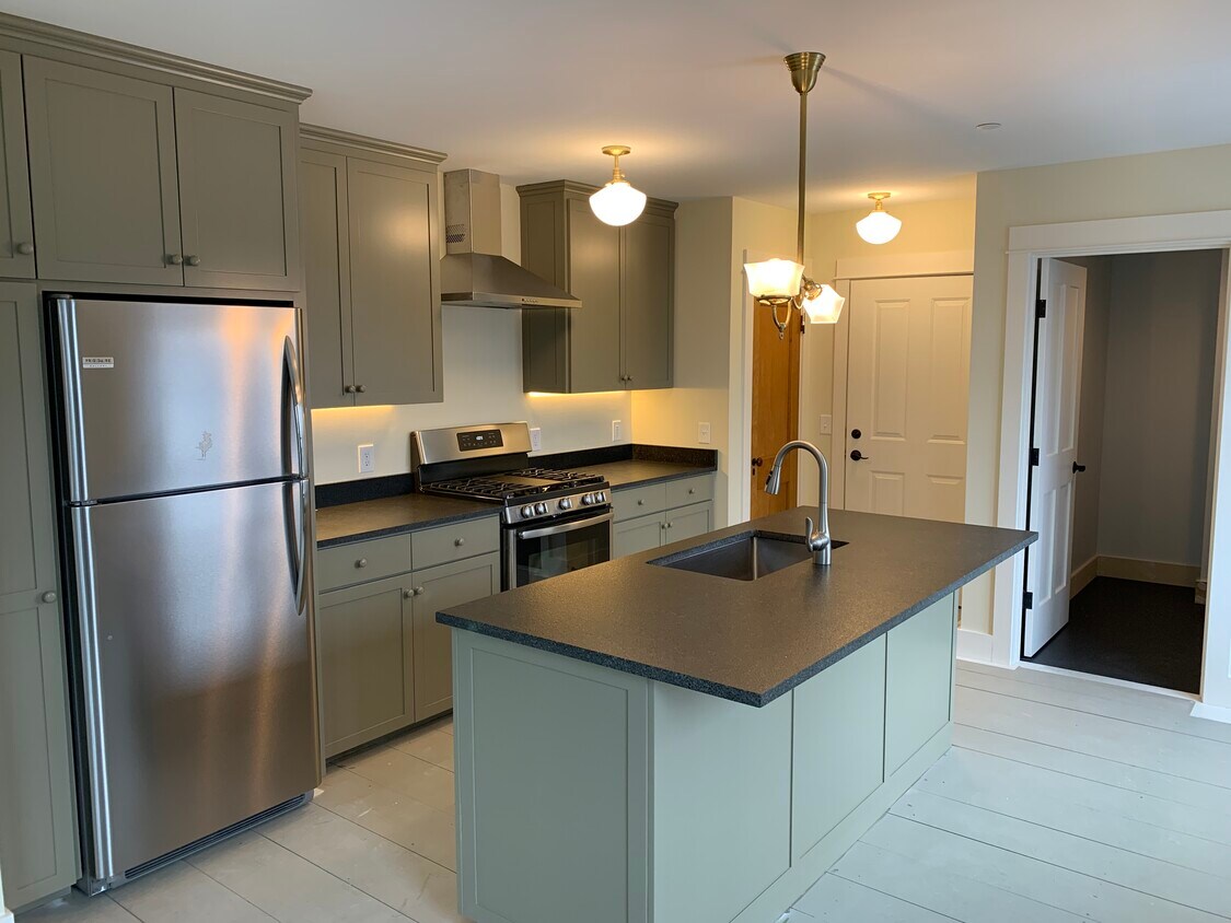 Kitchen features custom-milled cabinetry, under cabinet LED lighting, stainless steel appliances, gas range and exhaust fan. - 88 Walnut St