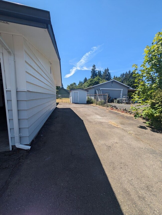 Building Photo - Rambler with large yard and storage shed...