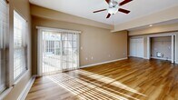 Located at 4720 Transit Rd in Depew, NY, this well-appointed single-floor home offers 2 bedrooms and 2 bathrooms across a thoughtfully designed layout. The open kitchen is a standout feature, showcasing rich dark cabinetry, granite countertops, stainless steel appliances including a range, microwave, and refrigerator, and light hardwood-style flooring that extends into the living area. The combined kitchen and living room space is bright and airy, with large windows that invite natural light and ceiling fans that add both comfort and style. Both bedrooms are carpeted and feature ceiling fans, with the spacious primary bedroom offering access to a dedicated walk-in closet equipped with wire shelving for ample storage. The two bathrooms are finished consistently with granite-topped dark wood vanities and large mirrors, with one bath including a shower and the other a tub-shower combo. Two hallways provide smooth circulation throughout the home. An attached single-car garage with an automatic opener rounds out the functional offerings of this residence. The overall aesthetic is clean and neutral, with warm beige tones, white trim, and consistent finishes throughout, creating a cohesive and move-in-ready environment.