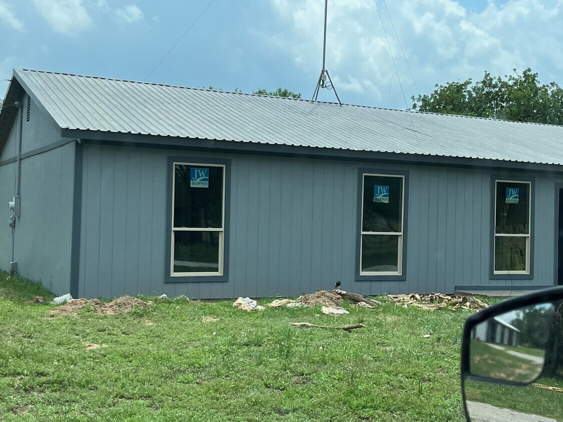 Front of house with flower bed under renovation - 2700 N FM 113