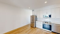 Located at 242 S Kalorama St in Ventura, California, this thoughtfully designed one-bedroom, one-bathroom unit offers a clean, contemporary aesthetic throughout. Warm hardwood-style flooring flows seamlessly across the entire space, complementing the crisp white walls and recessed lighting that create a bright, welcoming atmosphere.

The open kitchen is well-appointed with white shaker-style cabinetry extending to the ceiling for ample storage, a classic white subway tile backsplash, and a full suite of stainless steel appliances including a French door refrigerator, electric range, over-the-range microwave, and dishwasher. Light countertops and a single-basin sink complete the functional and stylish kitchen layout.

The bedroom is a comfortable, sunlit retreat featuring large black-framed windows that invite natural light and offer views of the surrounding Ventura neighborhood. Sliding panel closet doors provide generous storage, and the room's clean lines reinforce the unit's modern design sensibility.

The bathroom continues the cohesive aesthetic with a walk-in glass-enclosed shower finished in white subway tile, paired with the same warm flooring found throughout the unit.

This efficiently laid-out unit offers a practical single-floor design ideal for comfortable everyday living in the heart of Ventura, CA.