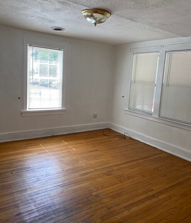 Front living room. - 825 Centre Ave NW