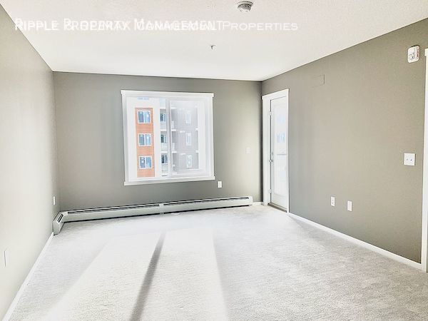 Photo du bâtiment - GORGEOUS 2 BED + DEN/ 2 BATH CONDO IN COMMUNITY OF SKYVIEW