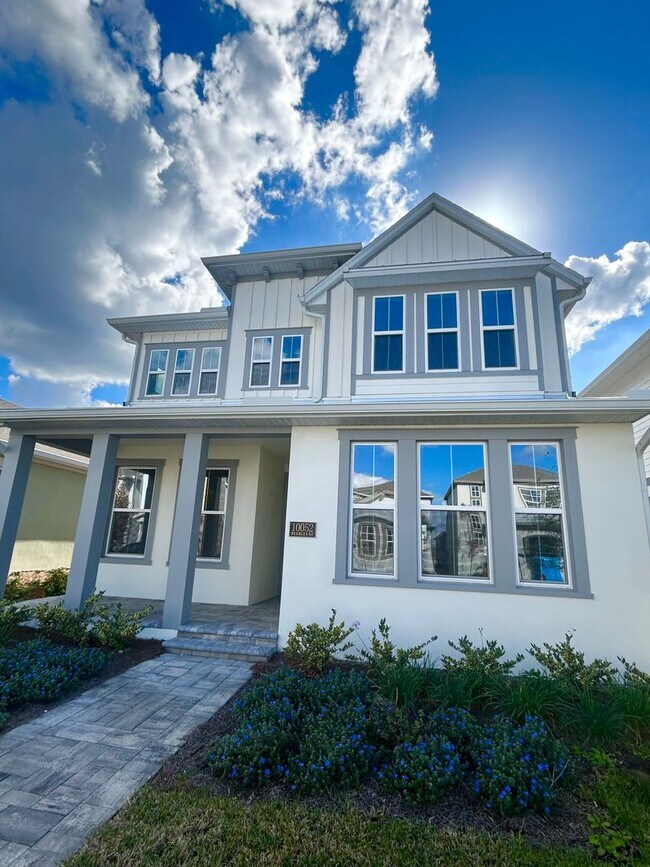 Foto del edificio - Gorgeous 4/3 Residence with a Private Back Lanai and a 3 Car Garage in the Delightful Laureate Pa...