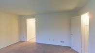Located at 801 W Park Avenue in Lindenwold, New Jersey, this two-story property presents a straightforward and functional layout suited for comfortable everyday living. The interior is finished with neutral wall tones and wall-to-wall carpeting that runs throughout the living areas, creating a warm and cohesive feel across both floors. The rooms feature standard panel doors with brass hardware, adding a classic touch to the clean, understated aesthetic. Floor vents provide efficient climate control, and multiple electrical outlets are conveniently positioned throughout. The open wall spaces allow for flexible furniture arrangement and personalization. The two-floor configuration offers a natural separation between living and private areas, providing added privacy and organization within the home. Overall, the property maintains a clean, move-in-ready condition with a simple, no-frills design that prioritizes practicality and livability in a residential Lindenwold neighborhood.