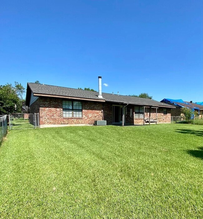 Fenced in backyard with covered patio - 2206 Angus St