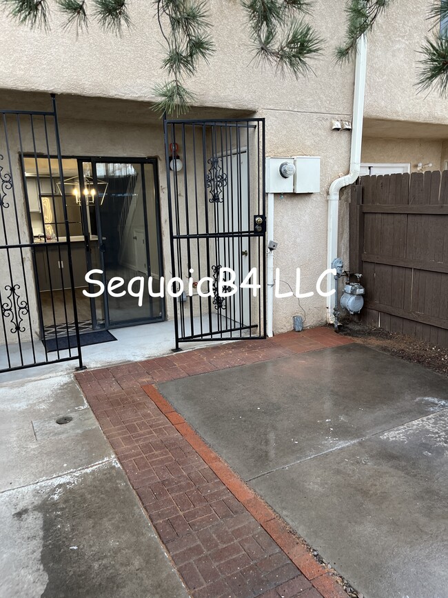 Private patio, coming from parking spaces, back entrance - 6041 Sequoia Rd NW