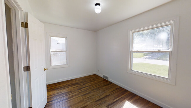 Hardwood floors and sunny bedroom 1 - 1103 Amherst Ave