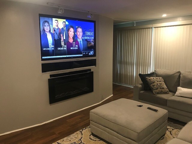 TV and fireplace - 205 E Maryland Ave