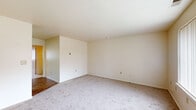 Located at 430 Eastern St in New Haven, Connecticut, this single-floor unit offers a straightforward and functional layout spread across multiple rooms. The living area is generously sized, featuring neutral-toned carpet flooring, cream-colored walls, and a textured ceiling that contributes to a clean, understated aesthetic. Multiple windows throughout the unit allow natural light to filter in, with vertical blinds providing privacy and light control.

The bedrooms are carpeted and well-proportioned, each equipped with windows that offer outdoor views of the surrounding neighborhood and greenery. Closet access is present in the sleeping areas, adding practical storage.

The kitchen is thoughtfully equipped with warm honey-toned wood cabinetry, granite-style countertops, and white appliances including a refrigerator, electric range, and dishwasher. Light wood-style flooring grounds the space and transitions into the bathroom areas.

The bathrooms include a full bath with a combined tub and shower unit, a wall-mounted mirror, and a vanity with under-sink storage, all finished in clean white tones with wood-look flooring. A separate half-bath area with a vanity and mirror provides additional convenience.

Overall, the unit presents a clean, move-in ready environment with a neutral palette and functional design throughout.