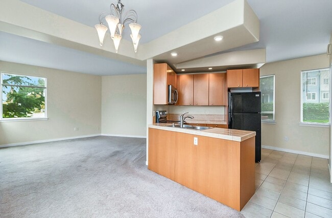 Building Photo - Large deluxe condo, 2 car garage, storage,...