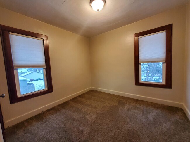 updated bedroom with window treatments and two closets - 253 10th Ave N