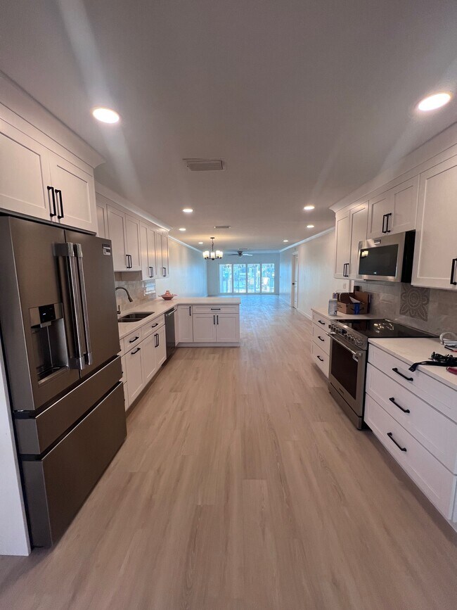 Kitchen view into living room - 282 Boca Ciega Point Blvd N