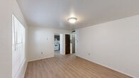 Located at 1701 N Avenue I in Crowley, Louisiana, this 2-bedroom, 1-bathroom unit offers a straightforward and functional single-floor layout. Light wood-style flooring runs consistently throughout the space, creating a clean, cohesive look from room to room.

The living room serves as the welcoming heart of the unit, featuring a front entry door, a large window with blinds that brings in natural light, and an open sightline toward the kitchen. The kitchen is well-equipped with brown cabinetry, a double-basin sink with laminate countertops, an electric range, and a full-size refrigerator. A dedicated window in the kitchen area adds additional natural light.

Both bedrooms are bright and simply designed, featuring the same light flooring and windows with blinds. The primary bedroom includes a double-door closet, offering practical storage space. The second bedroom also benefits from natural light through a window.

A hallway connects the bedrooms to the shared full bathroom, which includes a vanity with dark wood cabinetry, a toilet, and a shower/tub combination with a curtain. The flooring in the bathroom continues the light wood-style theme seen throughout the unit.

Overall, the space presents a clean, neutral palette with white walls and consistent flooring, making it a versatile and easy-to-personalize home in Crowley, LA.