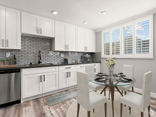 Hardwood floored dining room with view of gorgeous tiled kitchen. - Hi Point Townhomes