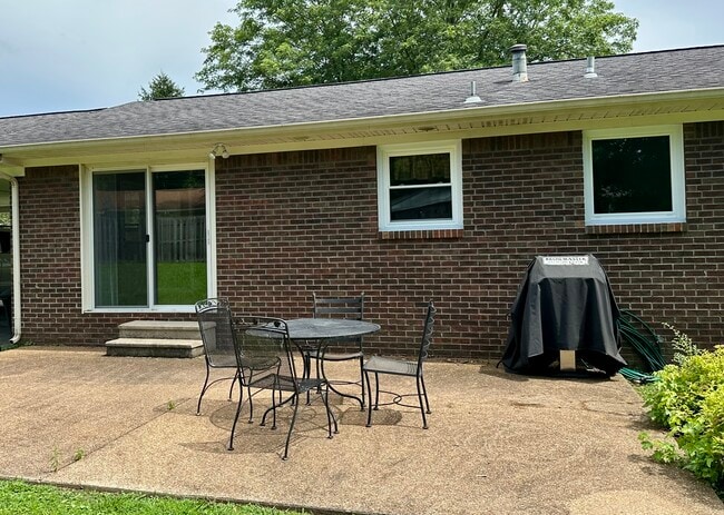 Wrought Iron table and chairs included. - 9 Garden Ln