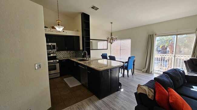 Building Photo - Partially Furnished 2/2 CONDO WITH  *BONUS DEN* & 2 CAR GARAGE!